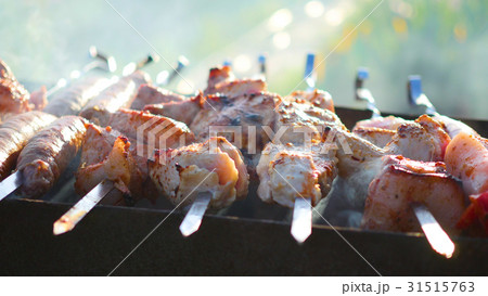 Barbecue Delicious Meat Cooked on the grill. A Barbecue Delicious Meat Cooked on the grill. A 31515763