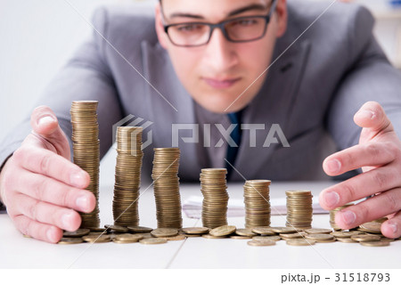 Businessman with golden coins in business growth Businessman with golden coins in business growth 31518793