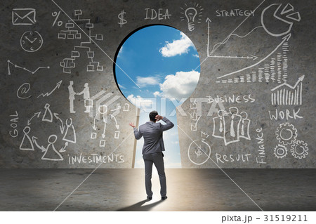 Businessman standing in front of keyhole Businessman standing in front of keyhole 31519211