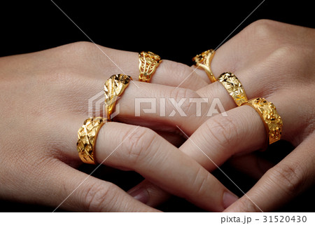 woman's hand with many jewelry rings  woman's hand with many jewelry rings  31520430