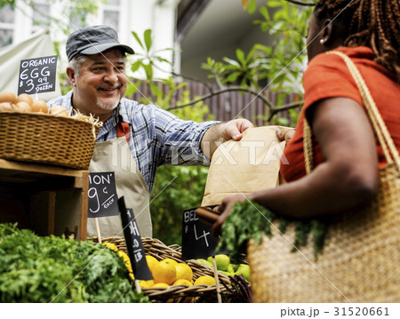 Man owner fresh grocery organic shop with customer Man owner fresh grocery organic shop with customer 31520661