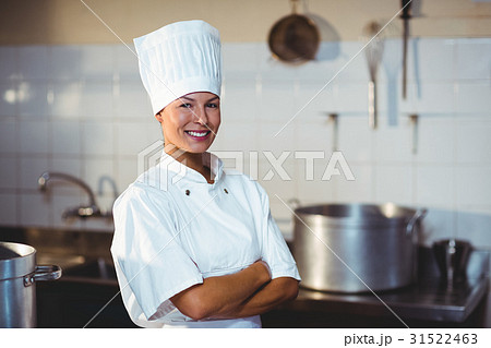 Portrait of happy chef standing with arms crossed 31522463