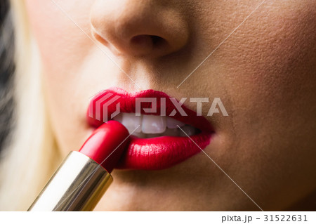 Close up of lips with makeup on them Close up of lips with makeup on them 31522631