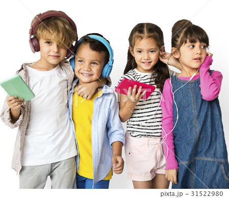 Happiness group of cute and adorable children listening music Happiness group of cute and adorable children listening music 31522980