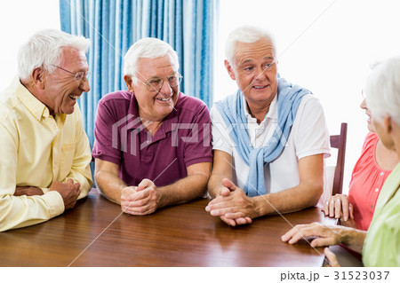 Seniors talking at table Seniors talking at table 31523037