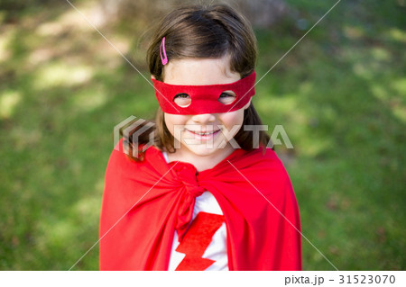 Young girl pretending to be a superhero Young girl pretending to be a superhero 31523070