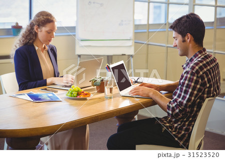 Business people using laptop Business people using laptop 31523520