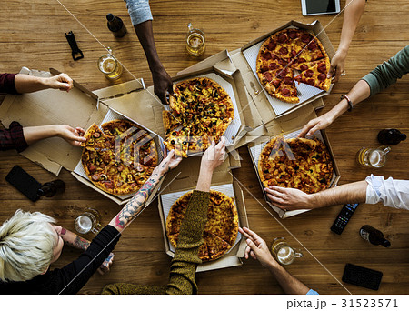 People Hands Grabbing Slice of Pizza People Hands Grabbing Slice of Pizza 31523571