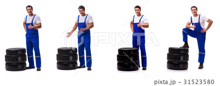 Handsome tyre repairman isolated on white 31523580