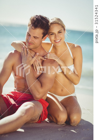 Couple having fun on beach Couple having fun on beach 31524341