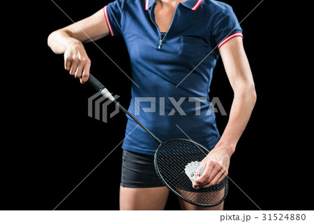 Badminton player holding a racquet ready to serve 31524880