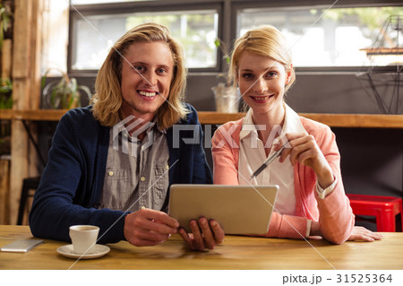 Colleagues using a tablet computer 31525364