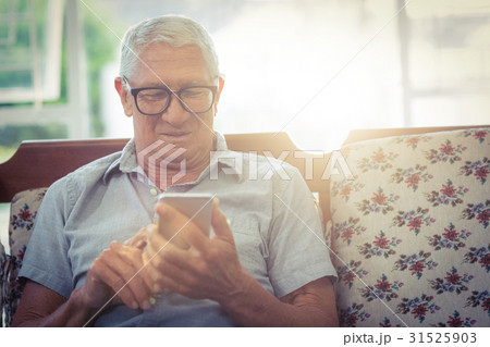 Senior man using mobile phone Senior man using mobile phone 31525903