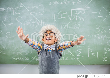 Excited schoolboy with hand spread in classroom 31526236