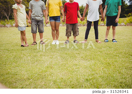 Cropped image of children holding hands Cropped image of children holding hands 31526341