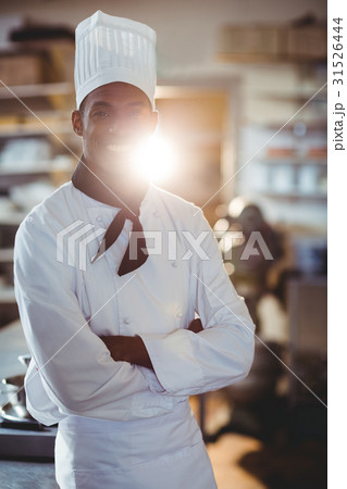 Portrait of happy chef standing with arms crossed Portrait of happy chef standing with arms crossed 31526444