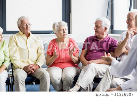 Seniors and nurse talking to each other 31526607