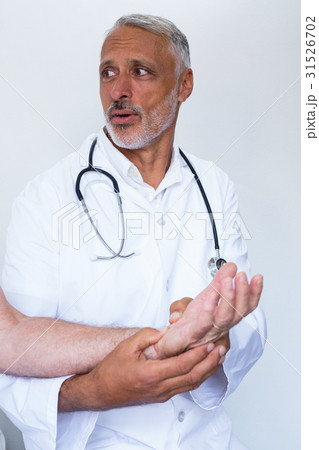 Male doctor giving palm acupressure treatment to the patient 31526702