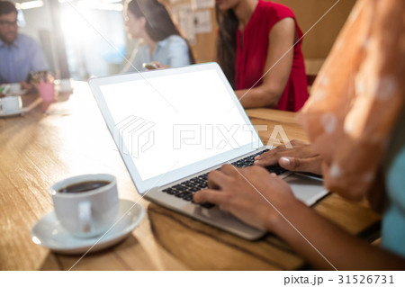 Hipster businesswoman using a laptop Hipster businesswoman using a laptop 31526731