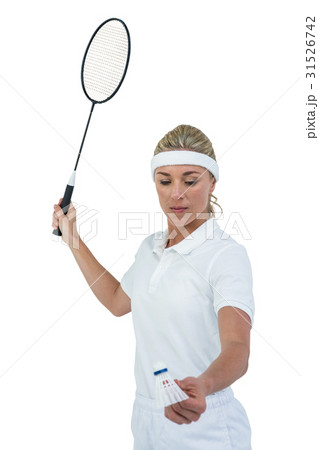 Female athlete holding a badminton racquet ready to serve 31526742