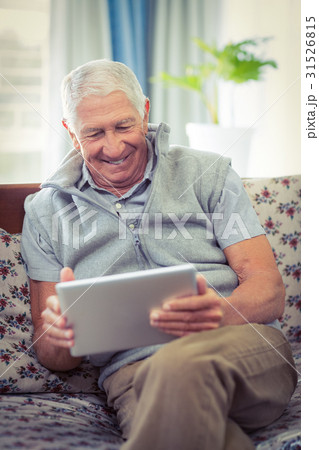 Senior man using digital tablet Senior man using digital tablet 31526815