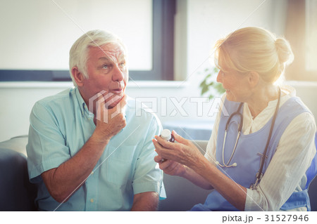 Senior man talking with female doctor 31527946