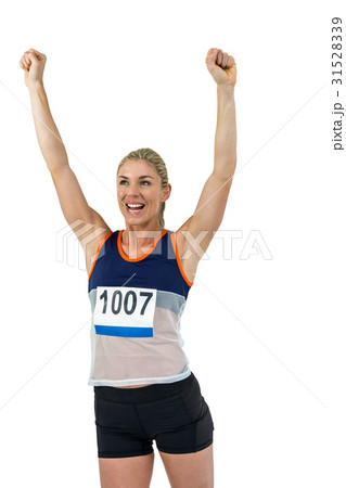 Female athlete posing after victory Female athlete posing after victory 31528339
