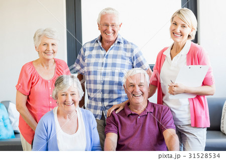 Nurse and seniors standing together 31528534
