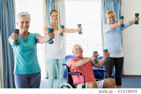 Seniors exercising with weights Seniors exercising with weights 31529045