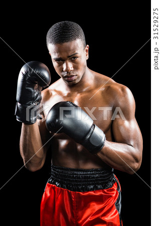 Portrait of boxer performing uppercut Portrait of boxer performing uppercut 31529275