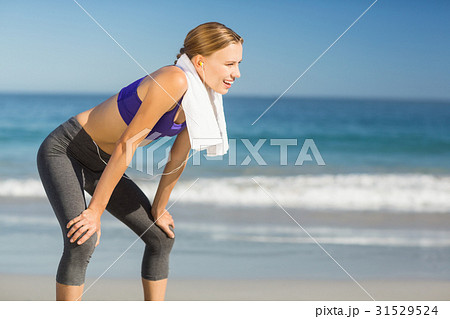 Beautiful woman taking break after exercising Beautiful woman taking break after exercising 31529524