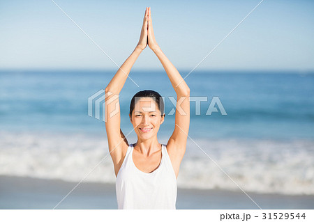 Woman performing yoga Woman performing yoga 31529544