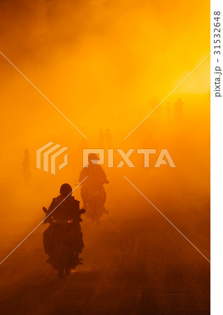 Man motorcycle with lot of dust in bagan road ,mya Man motorcycle with lot of dust in bagan road ,mya 31532648