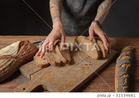 Baker Holds Bran Bread 31534681