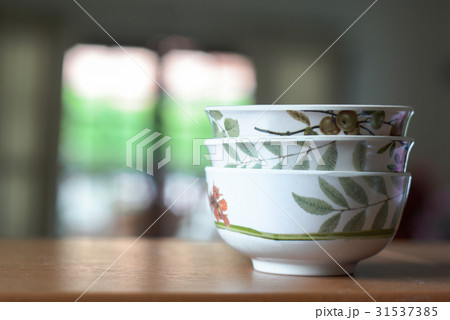 Bowls on a wooden desk and living room background Bowls on a wooden desk and living room background 31537385