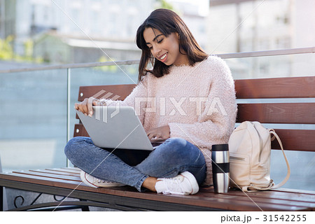 Savvy radiant girl using technology for 31542255