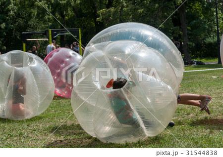 Teenagers play in Bubble bump 31544838
