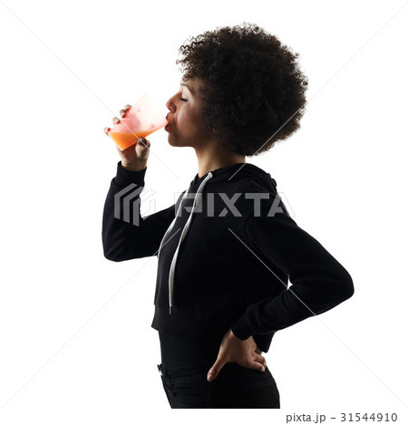 young teenager girl woman drinking orange juice young teenager girl woman drinking orange juice 31544910