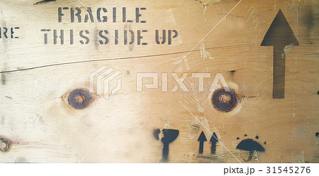 Fragile message type printed on wooden box Fragile message type printed on wooden box 31545276