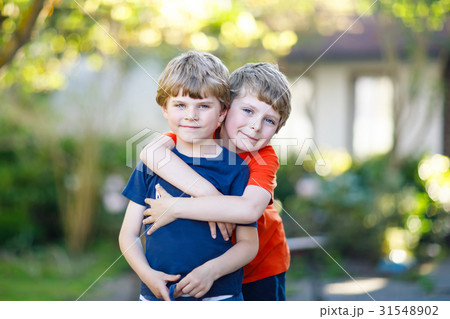Two little active school kids boys, twins and 31548902