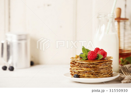 Milk and pancakes Milk and pancakes 31550930