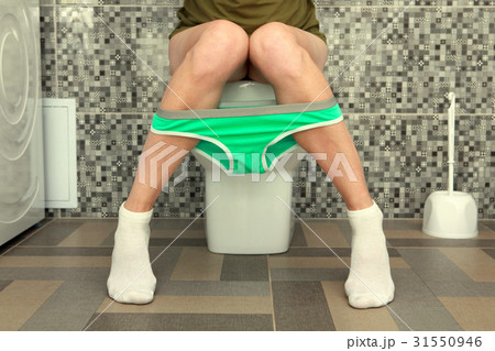 woman panties on legs in toilet 31550946