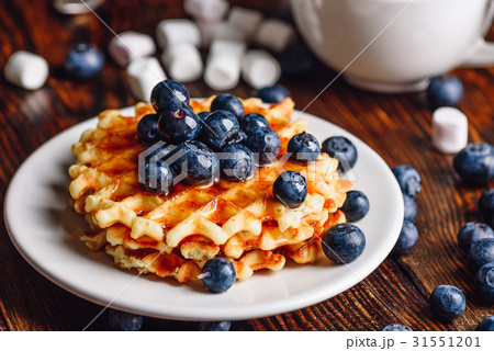 Belgian Waffles with Blueberry and Syrup. Belgian Waffles with Blueberry and Syrup. 31551201