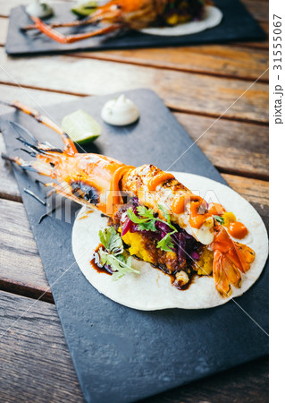 Taco with prawn or shrimp and sauce 31555067