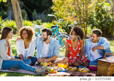 Friends having fun in park Friends having fun in park 31555480