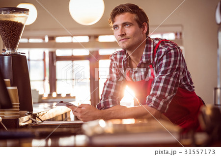 Waiter standing with notepad 31557173