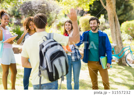 Group of friends waving each other 31557232