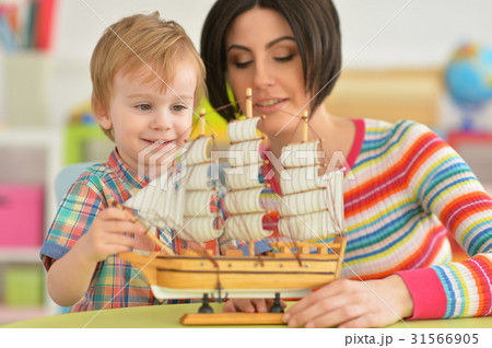 Young mother playing with son Young mother playing with son 31566905
