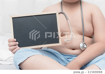 obese fat boy holding blank blackboard obese fat boy holding blank blackboard 31569998
