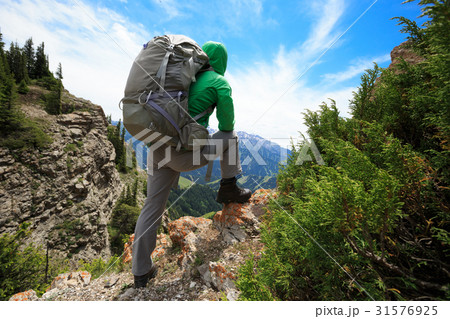 young woman hiker hiking on mountain top 31576925